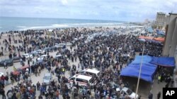 Libyan residents gather near the courthouse in Benghazi, Libya, February 23, 2011