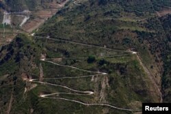 A mountain road is seen in an ethnic Lisu village in Luzhang township of Nujiang Lisu Autonomous Prefecture in Yunnan province, China, March 28, 2018.
