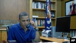 President Barack Obama holds a conference call from Camp David, Maryland, in this August 6, 2011 photo release. The deadliest day for U.S. forces in Afghanistan took place that day, when a Chinook helicopter crashed in Wardak, Afghanistan, killing 30 U.S