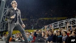 Lead singer Bono of Irish rock band U2 performs during their 360 Degree Tour (file photo)