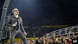 Lead singer Bono of Irish rock band U2 performs during their 360 Degree Tour (file photo)