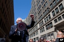 Democratic presidential candidate Sen. Bernie Sanders, I-Vt. speaks to Communication Workers of America (CWA) picketers in midtown Manhattan, New York, April 18, 2016.