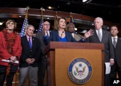 House Minority Leader Nancy Pelosi, D-Calif., is joined by fellow Democrats (L-R), Rep. Rosa DeLauro, D-Conn., Rep. John Yarmuth, D-Ky., Rep. Joe Crowley, D-N.Y., Rep. James E. Clyburn, D-S.C., Minority Whip Steny Hoyer, D-Md., and Rep. Ben Ray Lujan, D-N.M., as she speaks during a news conference on Capitol Hill in Washington, Jan. 19, 2018.