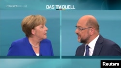 A screen that shows the TV debate between German Chancellor Angela Merkel of the Christian Democratic Union (CDU) and her challenger Germany's Social Democratic Party SPD candidate for chancellor Martin Schulz in Berlin, Germany, Sept. 3, 2017. 