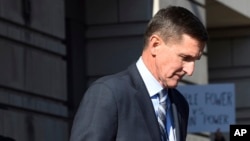 FILE - Former Trump national security adviser Michael Flynn leaves federal court in Washington, Dec. 1, 2017.