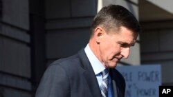 FILE - Former Trump national security adviser Michael Flynn leaves federal court in Washington, Dec. 1, 2017.