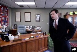 FILE - Mayor Pete Buttigieg talks with an AP reporter at his office in South Bend, Ind., Thursday, Jan. 10, 2019.