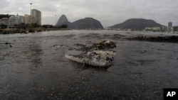Rio Olympics Filthy Water: Thrash floats on the water of Botafogo beach next to the Sugar Loaf mountain and the Guanabara Bay where sailing athletes will compete during the 2016 Summer Olympics in Rio de Janeiro, Brazil, Saturday, July 30, 2016. 