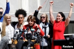 Attorney Gloria Allred stands with accusers of actor and comedian Bill Cosby after a jury convicted him in a sexual assault retrial at the Montgomery County Courthouse in Norristown, Pennsylvania, April 26, 2018.