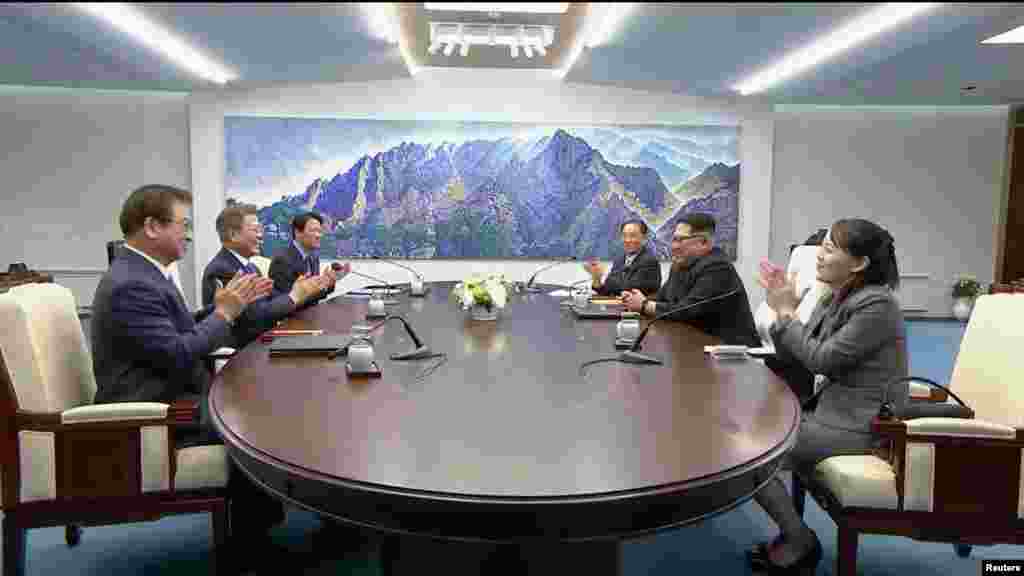 South Korean President Moon Jae-in and North Korean leader Kim Jong Un attend the inter-Korean summit at the truce village of Panmunjom, in this still frame taken from video, South Korea April 27, 2018. 