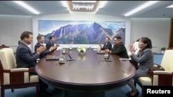South Korean President Moon Jae-in and North Korean leader Kim Jong Un attend the inter-Korean summit at the truce village of Panmunjom, in this still frame taken from video, South Korea, April 27, 2018.