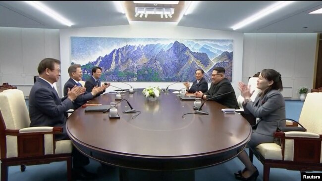 South Korean President Moon Jae-in and North Korean leader Kim Jong Un attend the inter-Korean summit at the truce village of Panmunjom, in this still frame taken from video, South Korea, April 27, 2018.