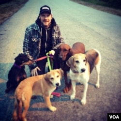 Charlie King with the family's many dogs. Photo: A. Nunn