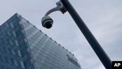 A security camera stands outside the main Telefonica headquarters in Madrid, Spain, May 12, 2017. The Spanish government said several companies including Telefonica had been targeted in ransomware cyberattack that affected the Windows operating system of employees' computers.