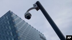 A security camera stands outside the main Telefonica headquarters in Madrid, Spain, May 12, 2017. 