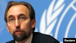 FILE - Zeid Ra'ad al-Hussein, U.N. High Commissioner for Human Rights, pauses during a news conference at U.N. European headquarters in Geneva, Oct. 16, 2014. 
