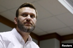 FILE - Russian anti-corruption campaigner and prominent opposition figure Alexei Navalny is seen attending a hearing at the Moscow City Court in Moscow, Russia, Feb. 12, 2016.