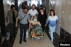 Pro-Kurdish Peoples' Democratic Party (HDP) lawmaker Leyla Guven, who ended her hunger strike after a call from jailed PKK leader Abdullah Ocalan, leaves her home to go to a hospital in Diyarbakir, Turkey, May 26, 2019.