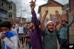 Supporters of Jammu Kashmir Liberation Front (JKLF) shout slogans during a protest march towards UN Military Observer Group headquarters in Srinagar, Indian controlled Kashmir, July 21, 2017.