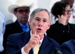 FILE - In this March 16, 2020 file photo, Texas Gov. Greg Abbott speaks during a news conference in San Antonio.