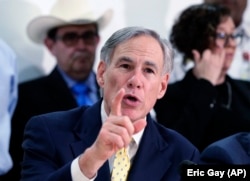 FILE - In this March 16, 2020 file photo, Texas Gov. Greg Abbott speaks during a news conference in San Antonio.