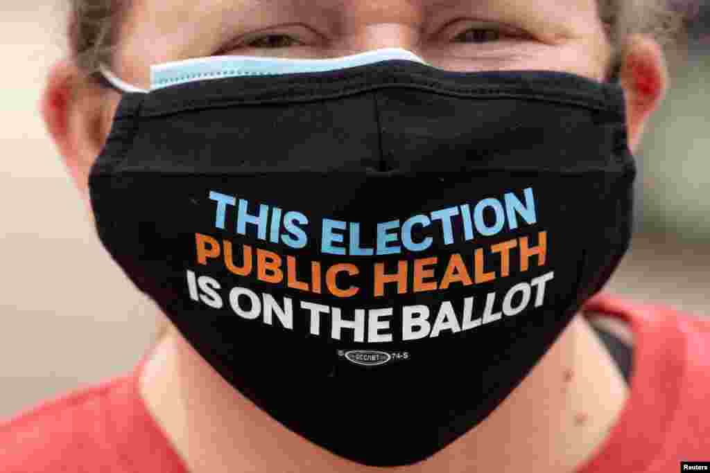 A teacher joins in with healthcare workers during a protest for Personal Protective gear at Kindred Hospital Westminster, a 109-bed long-term care facility, during the outbreak of the COVID-19 in Westminster, California, July 22, 2020.