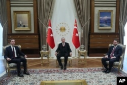 Turkey's President Recep Tayyip Erdogan, center, Turkey's Economy Minister Berat Albayrak, right, who is also his son-in-law, meet with Jared Kushner, left, U.S. President Donald Trump's adviser and son-in-law, at the Presidential Palace in Ankara, Turkey
