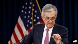 FILE - Federal Reserve Board Chair Jerome Powell speaks at a news conference following a two-day meeting of the Federal Open Market Committee, May 1, 2019, in Washington.