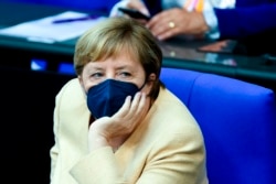 German Chancellor Angela Merkel listens to a debate about the situation in the country ahead of the upcoming national election in Berlin, Sept. 7, 2021.