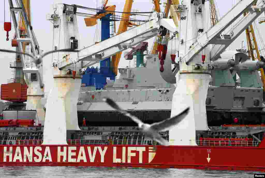 Ukraine mobilised on Sunday for war and called up its reserves, after Russian President Vladimir Putin threatened to invade in the biggest confrontation between Moscow and the West since the Cold War. Pictured here is a Zubr Class air cushion landing craft at the port of the Crimean port city of Feodosiya, Ukraine, March 2, 2014. 