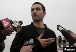 FILE - Former U.S. Marine Amir Hekmati, who was held in an Iranian prison, arrives at an airport in Flint, Michigan, Jan. 21, 2016.