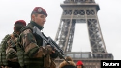 French soldiers patrol near the Eiffel Tower in Paris as part of the highest level of "Vigipirate" security plan after a shooting at the Paris offices of Charlie Hebdo, Jan. 9, 2015.