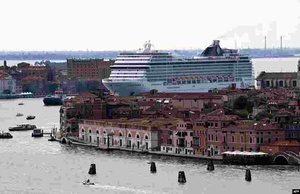 The MSC Orchestra cruise ship sails across the basin as it leaves Venice, Italy, June 05, 2021.