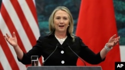 FILE - U.S. Secretary of State Hillary Clinton speaks during her joint conference with Chinese Foreign Minister Yang Jiechi at the Great Hall of the People in Beijing.