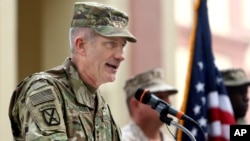 FILE - U.S. commander in Afghanistan, U.S. Army Gen. John W. Nicholson, speaks during a change of command ceremony at the Resolute Support Headquarters in Kabul, Afghanistan, March 2, 2016.