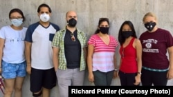 Students from the Peltier Aerosol lab at the University of Massachusetts are wearing the types of masks tested. From left: a paper surgical mask, two American-made N-95 masks, two of the most common types of washable cloth masks, and a face-fitting cloth mask with exhalation vents.