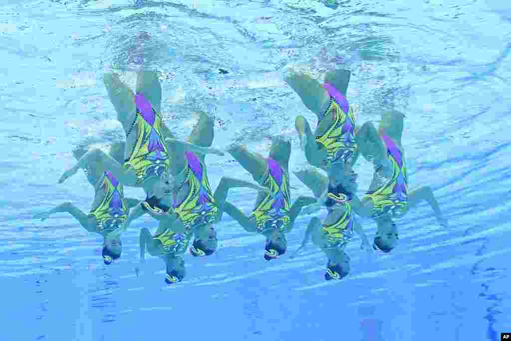 The Italy artistic swimming team competes during the team technical routine at the 2020 Summer Olympics, in Tokyo, Japan. 