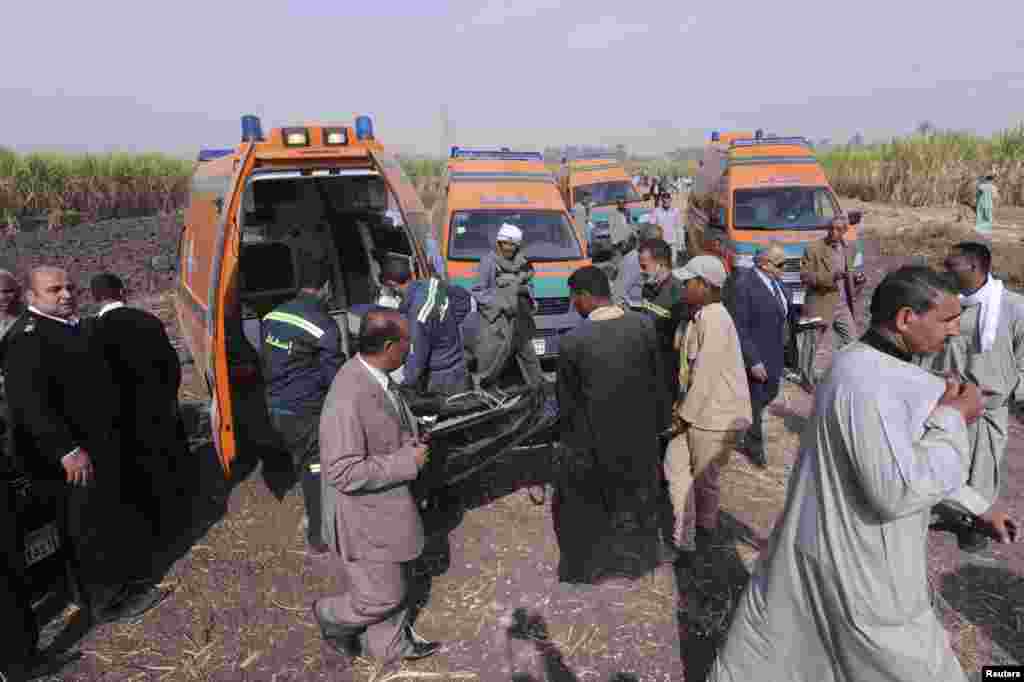 The body of one of the tourists who died after a hot air balloon crashed is placed in an ambulance in Luxor, Egypt, Feb. 26, 2013. 