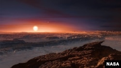 This artist’s impression shows a view of the surface of the planet Proxima b orbiting the red dwarf star Proxima Centauri, the closest star to the solar system. (Credit NASA)