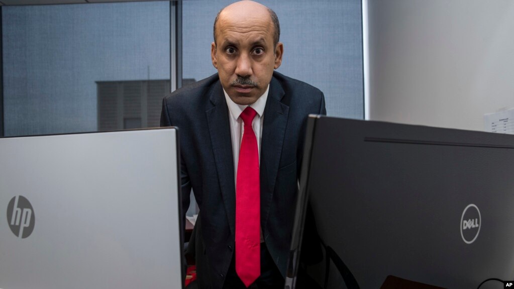 FILE - Ali AlAhmed poses for a photograph in his office in Washington, Oct. 26, 2018.