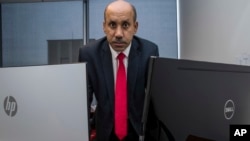 FILE - Ali AlAhmed poses for a photograph in his office in Washington, Oct. 26, 2018.