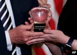 The National Teacher of the Year award, presented to Mandy Manning, a teacher at the Newcomer Center at Joel E. Ferris High School in Spokane, Wash., in the East Room of the White House in Washington, May 2, 2018.