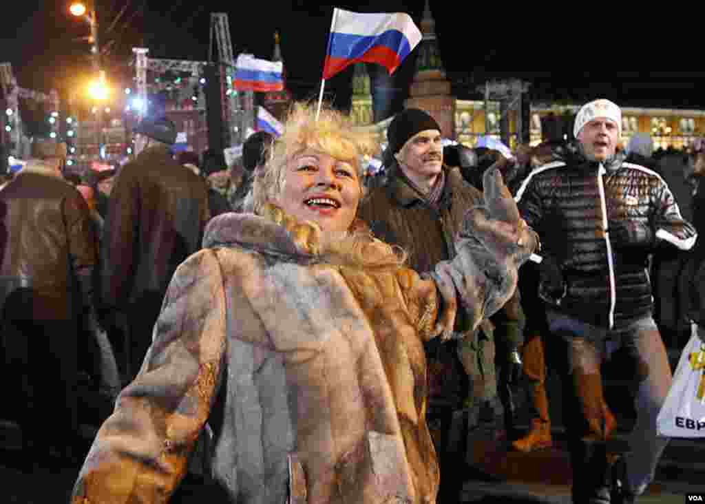 A supporter of presidential candidate Vladimir Putin dances during a rally in Moscow, March 4, 2012. Opposition leaders said the presidential election was marred by widespread violations. (AP)