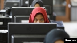 Students at a government-run Vocational Training Center study basic computer skills in South Jakarta, Indonesia, Nov. 10, 2017.