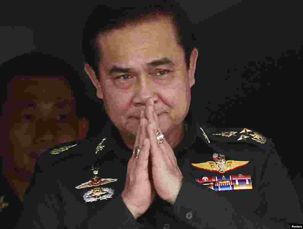 Thailand's newly appointed Prime Minister Prayuth Chan-ocha gestures in a traditional greeting during his visit to the 2nd Infantry Battalion, 21st Infantry Regiment, Queen's Guard in Chonburi province, on the outskirts of Bangkok Aug. 21, 2014.