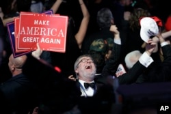 Supporters of Republican presidential candidate Donald Trump react as they watch the election results during Trump's election night rally, in New York, Nov. 8, 2016.
