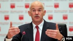 PM Yunani George Papandreou sedikit lega atas penilaian positif UE dan IMF.