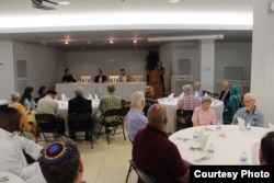 Joan Liversidge, a faith leader from the Quaker Friends House, shares the meaning of fasting during an iftar dinner at the Bait-ur-Rehman Mosque in Silver Spring, Maryland. (Courtesy - Bait-ur-Rehman Mosque)