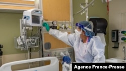 FILE - A medical worker at the US Department of Veterans Affairs (VA) Boston Healthcare system campus and medical center in West Roxbury, Massachusetts on Jan. 11, 2022. 