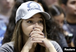 FILE - A supporter of Democratic U.S. presidential candidate Bernie Sanders reacts to the primary election results in the states of Florida, Ohio and Illinois during a campaign rally in Phoenix, Arizona, March 15, 2016.